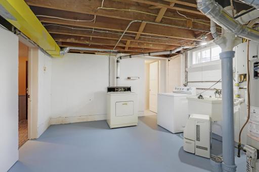 Laundry includes a washer, dryer and laundry tub and faucet.