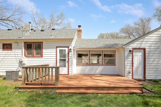 Low-maintenance composite deck is adjacent to the sunroom/breezeway.