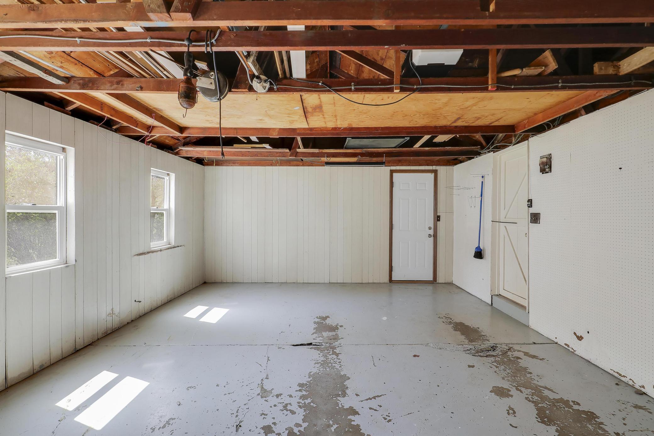 Garage has doors to the backyard and sunroom/breezeway. There are 2 windows to allow for sunlight.
