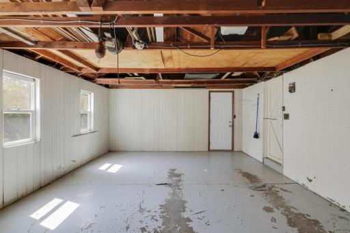 Garage has doors to the backyard and sunroom/breezeway. There are 2 windows to allow for sunlight.