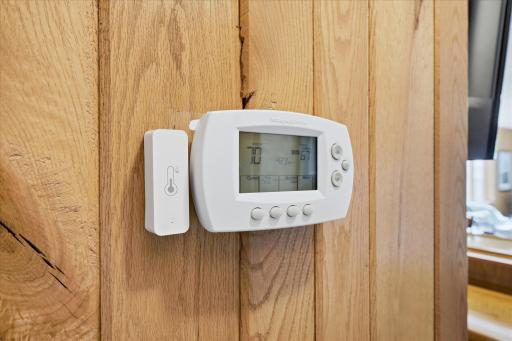 Awesome home detail - dual zone HVAC. This is the lower level thermostat.