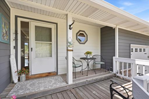 The front porch greets you with a Vivint video doorbell, and plenty of space for seating!