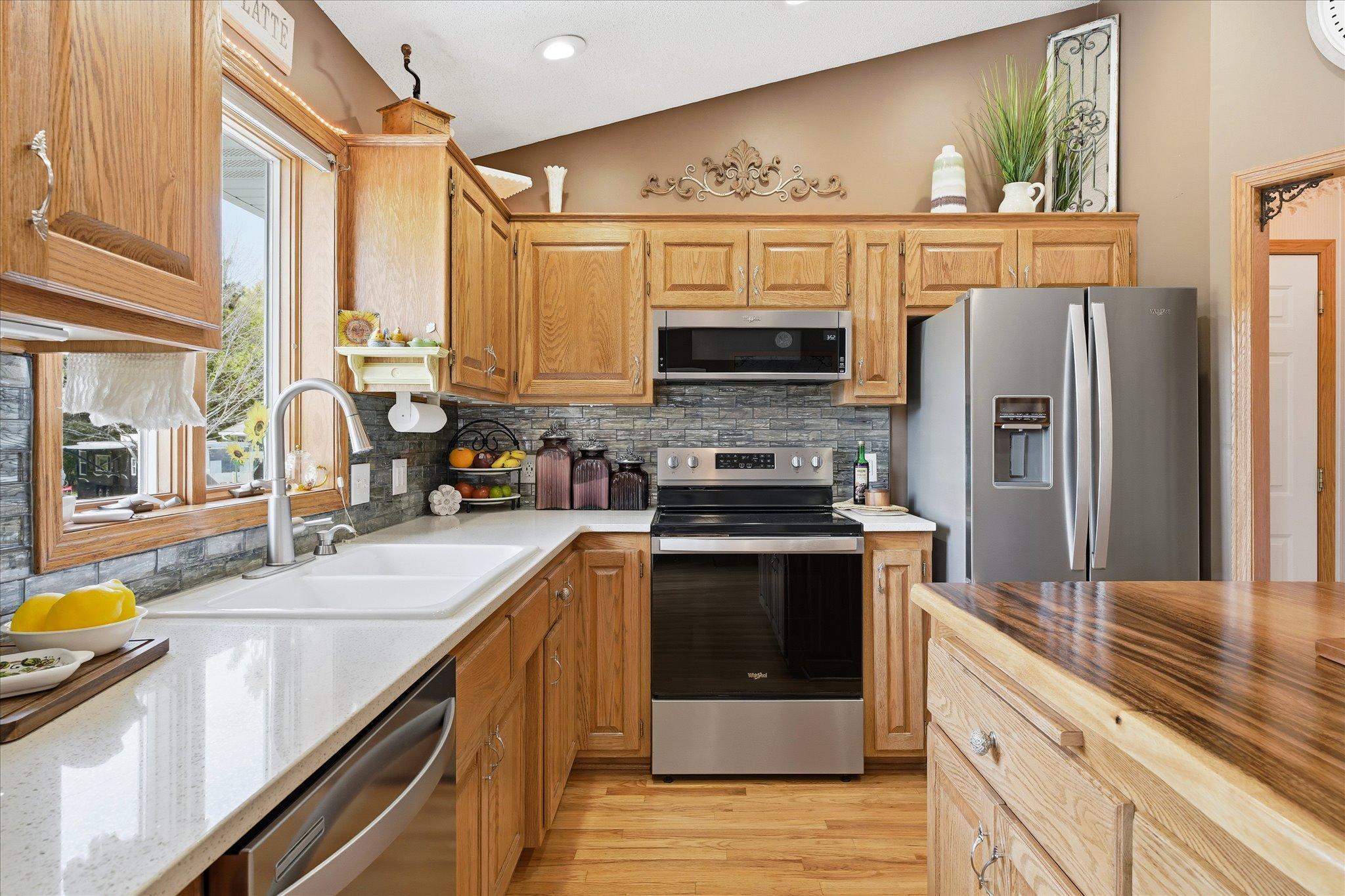 The backsplash, Kohler sink, nickel faucet and all the cabinet pulls were also replaced three years ago.