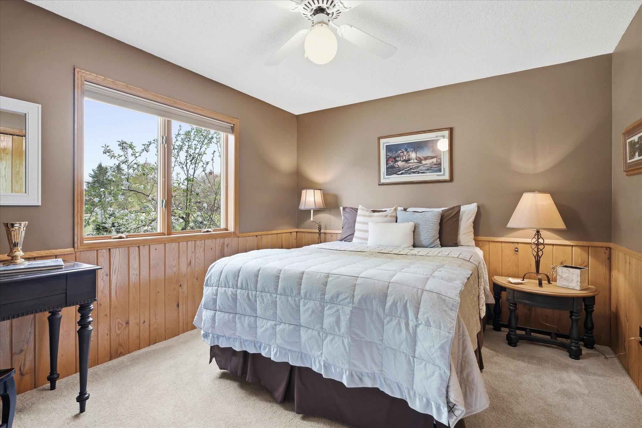 From this bed, you will wake up to the view of a beautiful birch bark tree.
