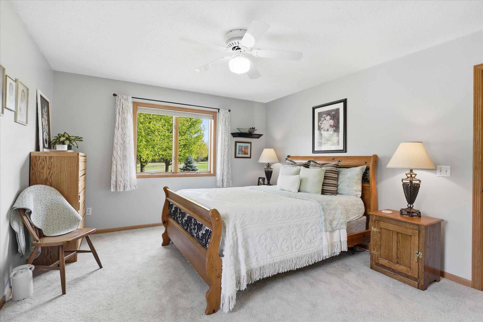 The neutral paint, the ceiling fan and the Andersen window rounds out this beautiful room.