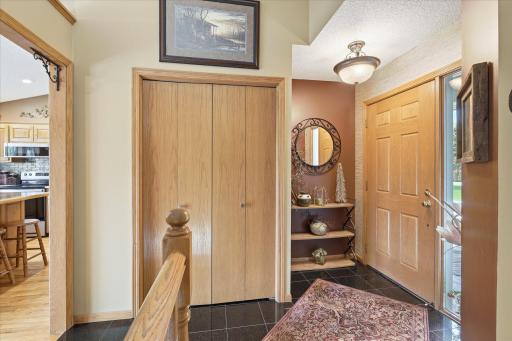 At last, we enter the house! The entryway features two coat closets, tile flooring and modern, neutral paint.