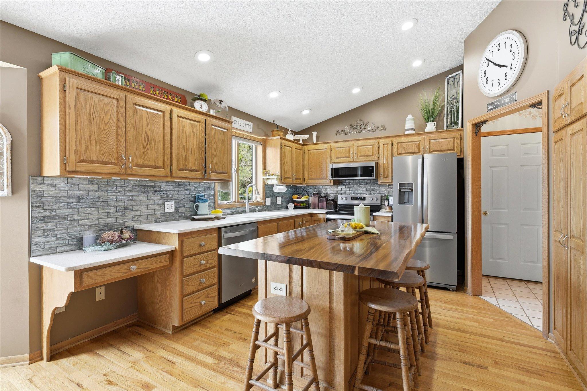 The live edge Acacia center island is gorgeous. The solid oak hardwood flooring was just refinished three years ago.
