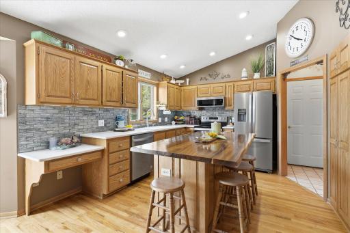 The live edge Acacia center island is gorgeous. The solid oak hardwood flooring was just refinished three years ago.