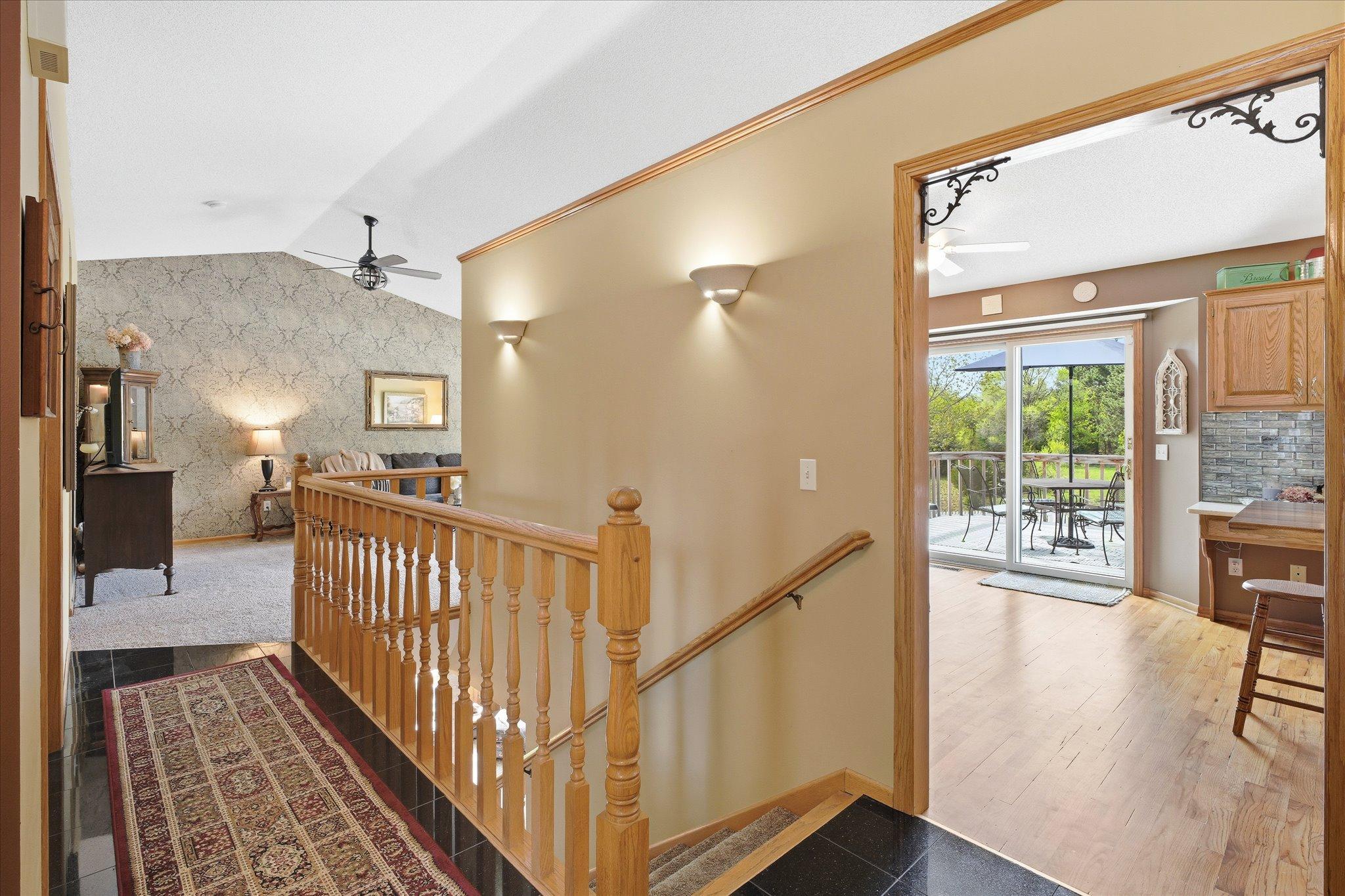 From the front door, you can go left into the living room, or straight ahead to the kitchen. Or you can head downstairs too!