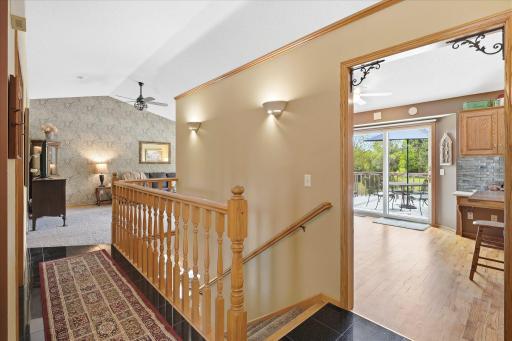 From the front door, you can go left into the living room, or straight ahead to the kitchen. Or you can head downstairs too!