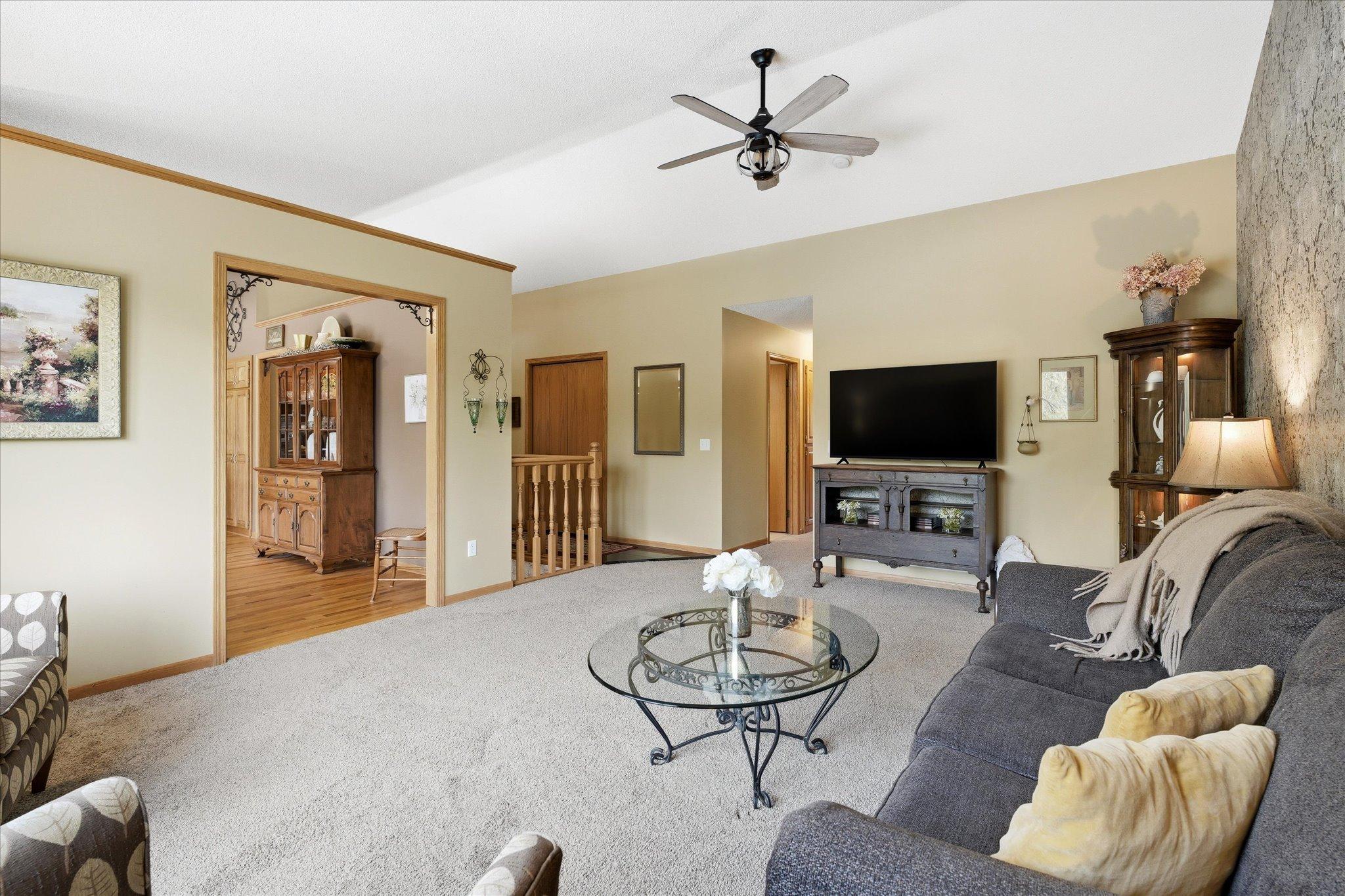 The hallway back there leads to three main level bedrooms and two main level bathrooms, including a primary ensuite.