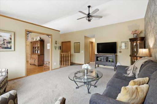 The hallway back there leads to three main level bedrooms and two main level bathrooms, including a primary ensuite.