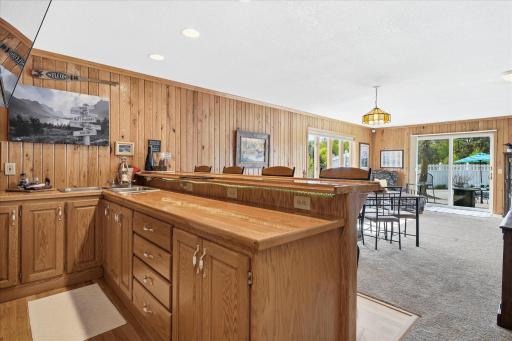 There is so much cabinet space in the bar, and a dual basin sink too!