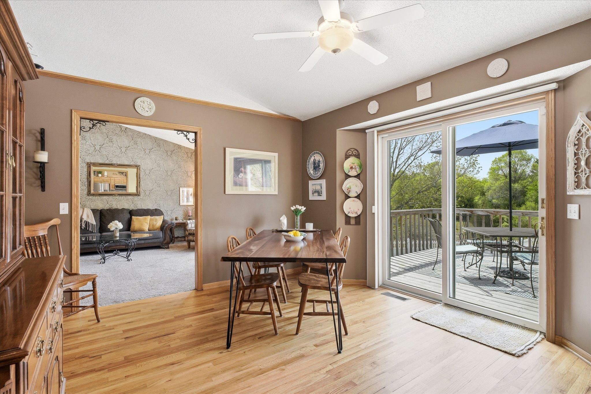 The eat-in kitchen and the two-tier deck are directly connected to one another.