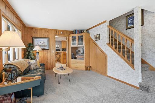 The space in this home is stewarded so well. There is a game storage cabinet under the steps!