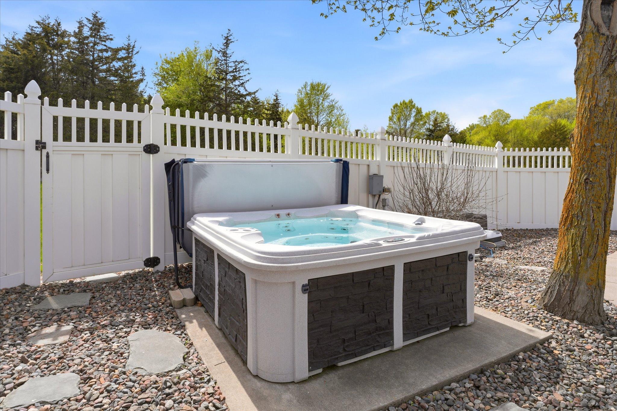 The 7 x 7 hot tub is included with the home.