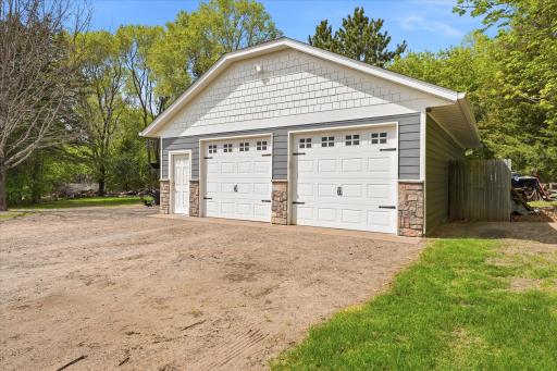 There is an extra fenced-in strorage area next to the building. And the building had new siding, stone, roofing, gutters all installed in 2024.