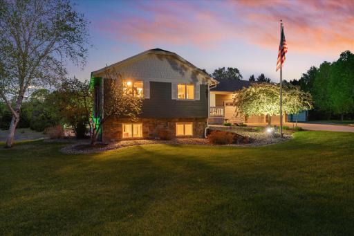 The trees and the flagpole headline a landscape that's easy to maintain and be proud of.