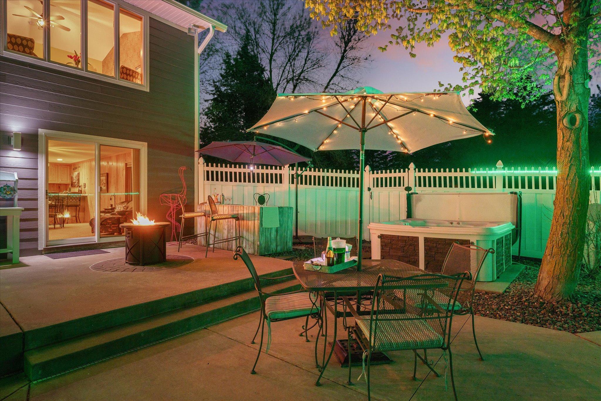 There is an outdoor bar to belly up at and a hot tub to sit in too.