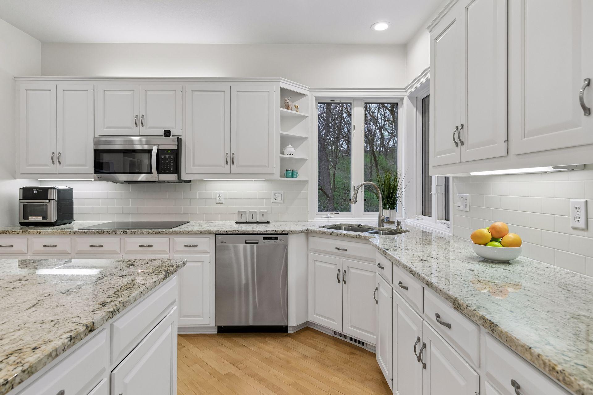 Kitchen window to outside and sunroom