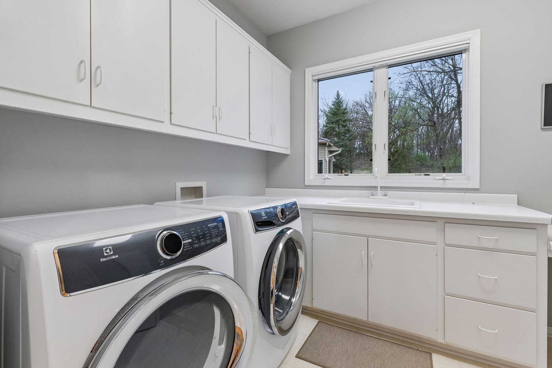 Main Floor Laundry, more space not shown, wall mounted iron board & closet