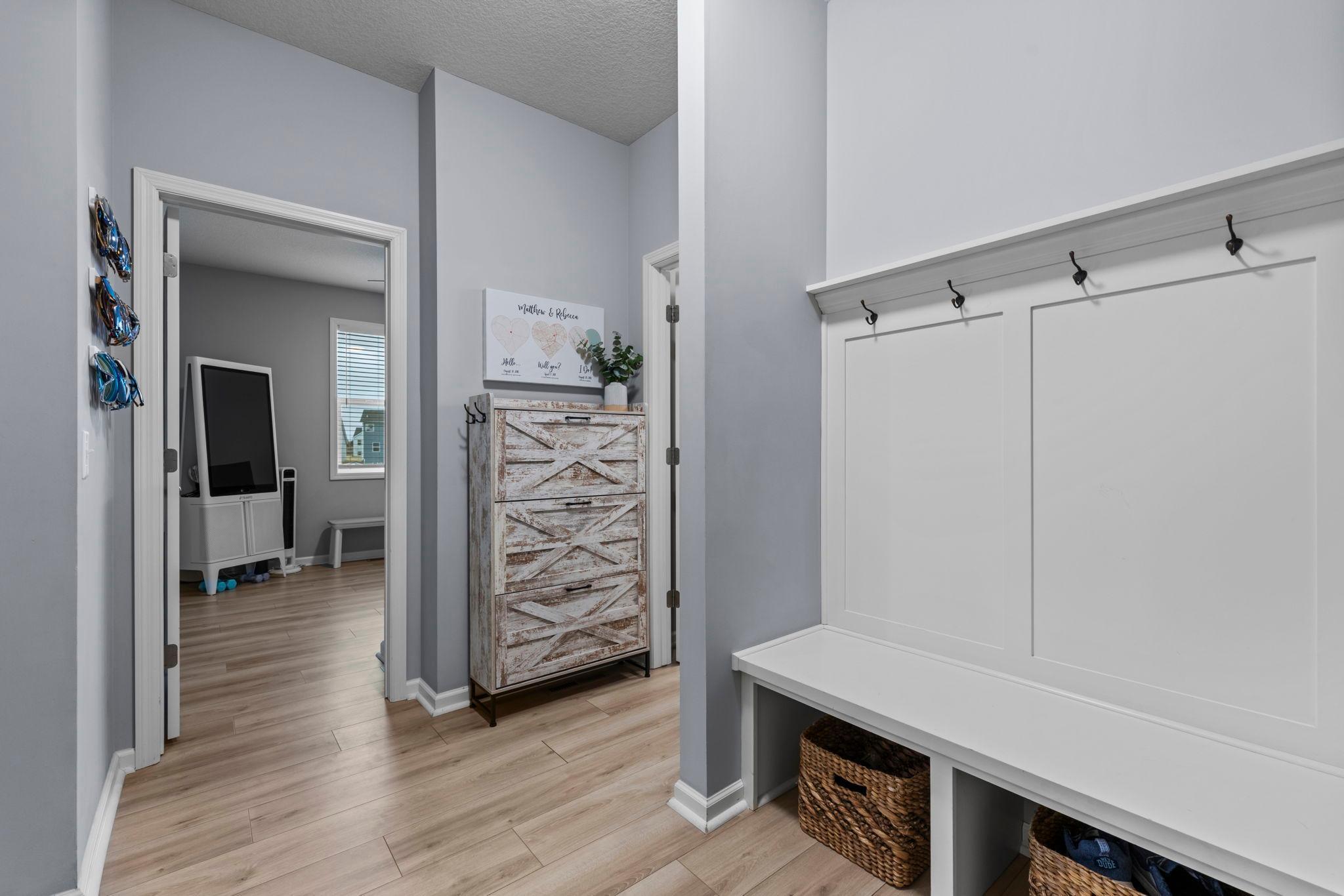 Mudroom bench off of the bedroom and bath leads to the garage!