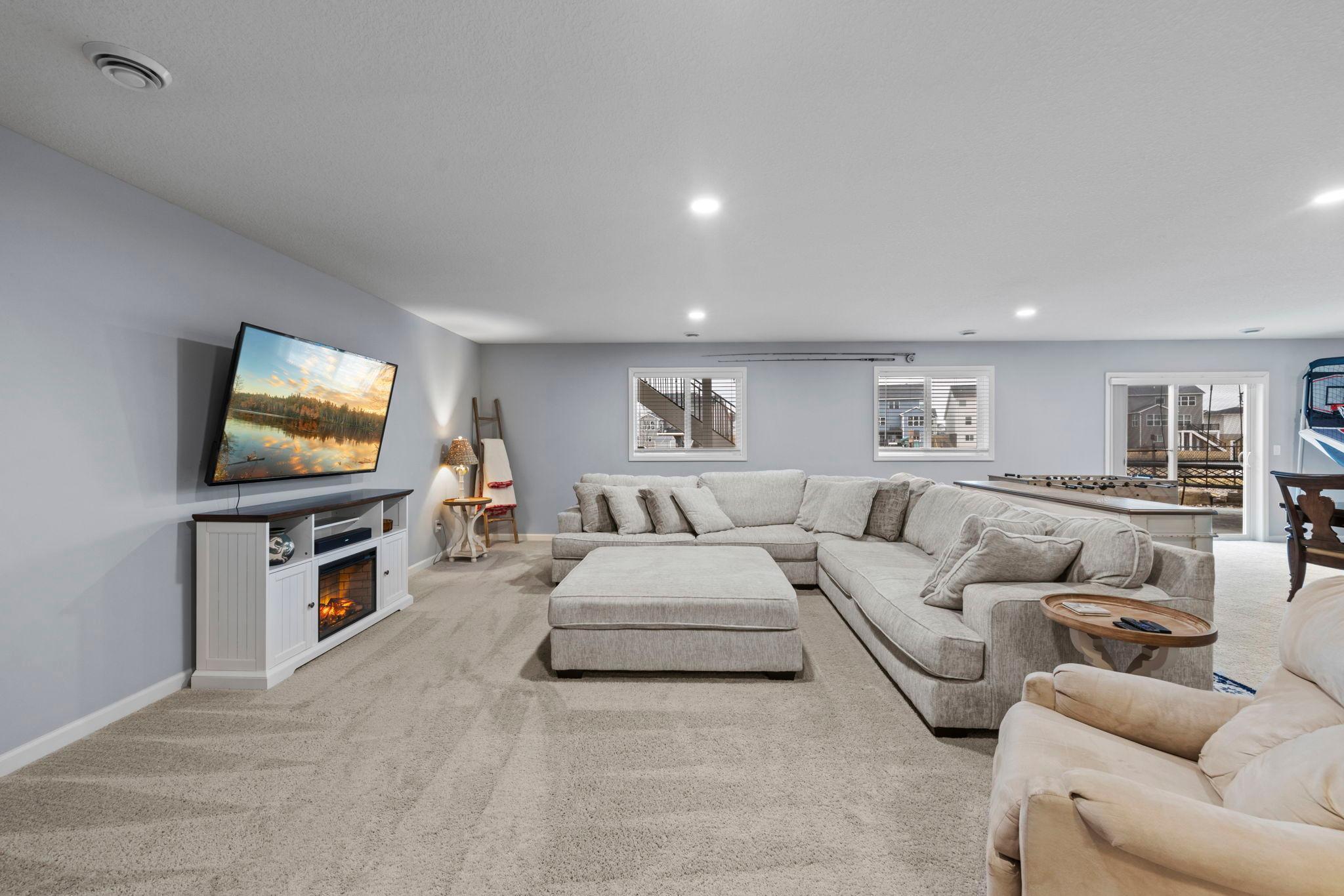 Behind the family room enjoy a lower-level bedroom, storage space, and sliding door to the walkout backyard!