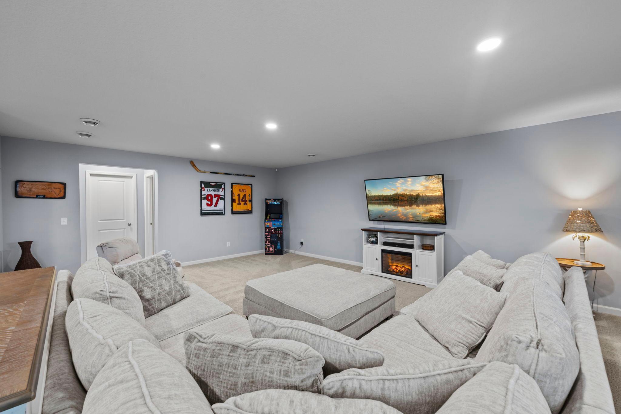 Off of the family room is a 3/4 bathroom, storage space, and mechanical room