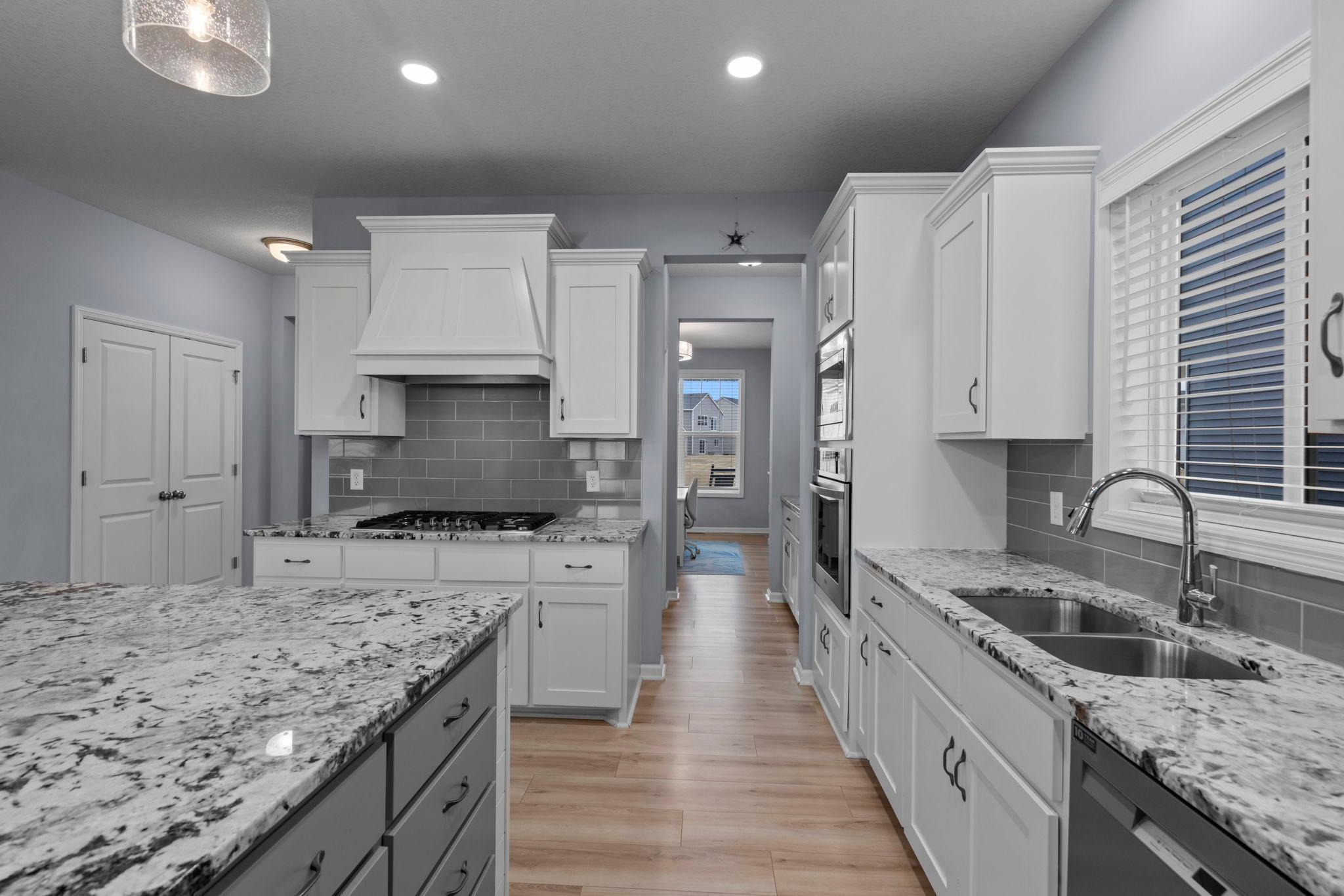 Gourmet style kitchen with plenty of lighting and space.