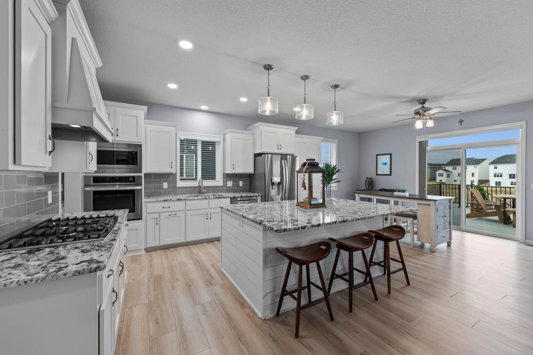 Gourmet kitchen with shiplap surround on island, extra outlets, fixtures, and new flooring plus trim redone too.