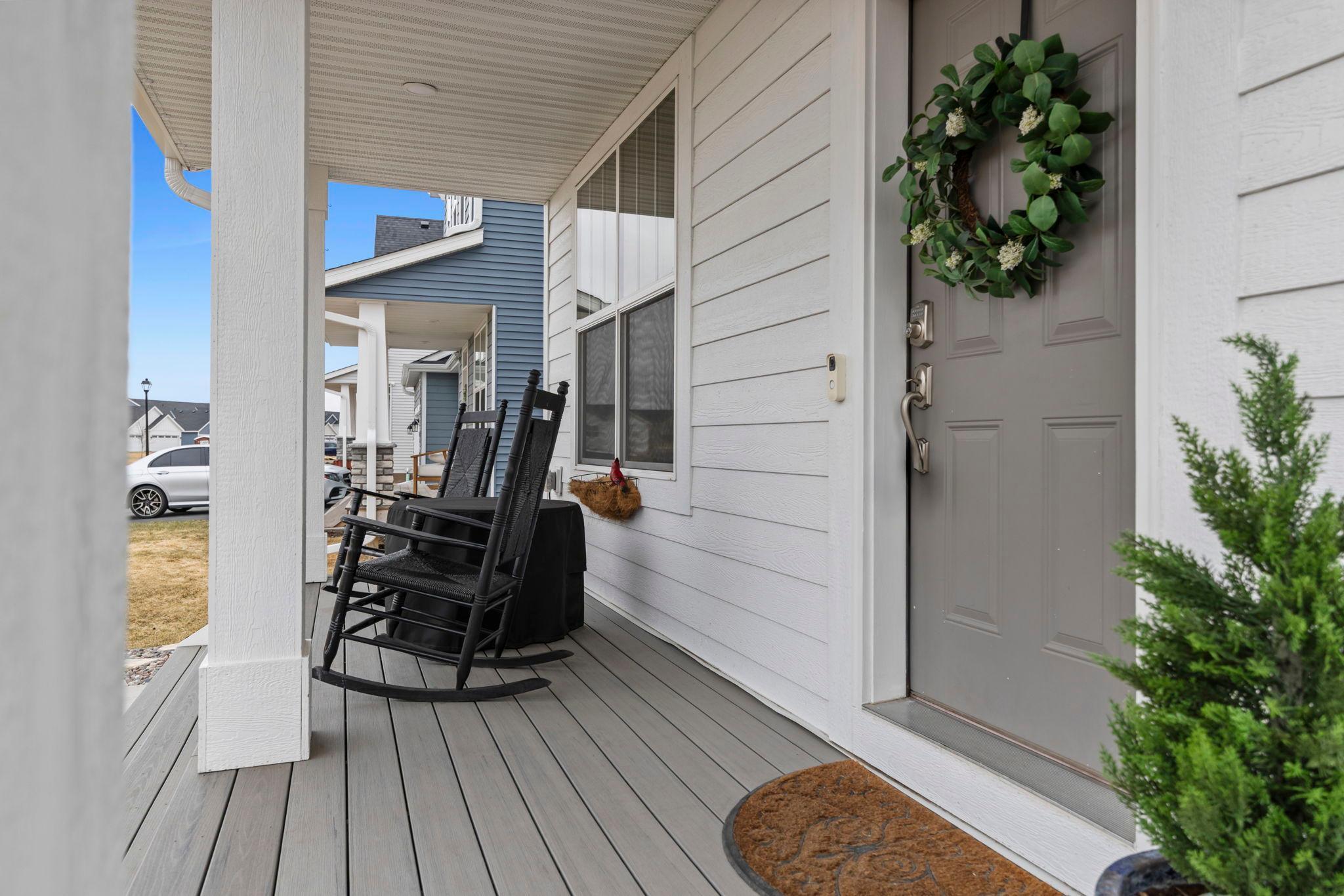 Updated composite maintenance free front porch with extended stairs corner to corner. Removed builder-grade wood porch and steps.