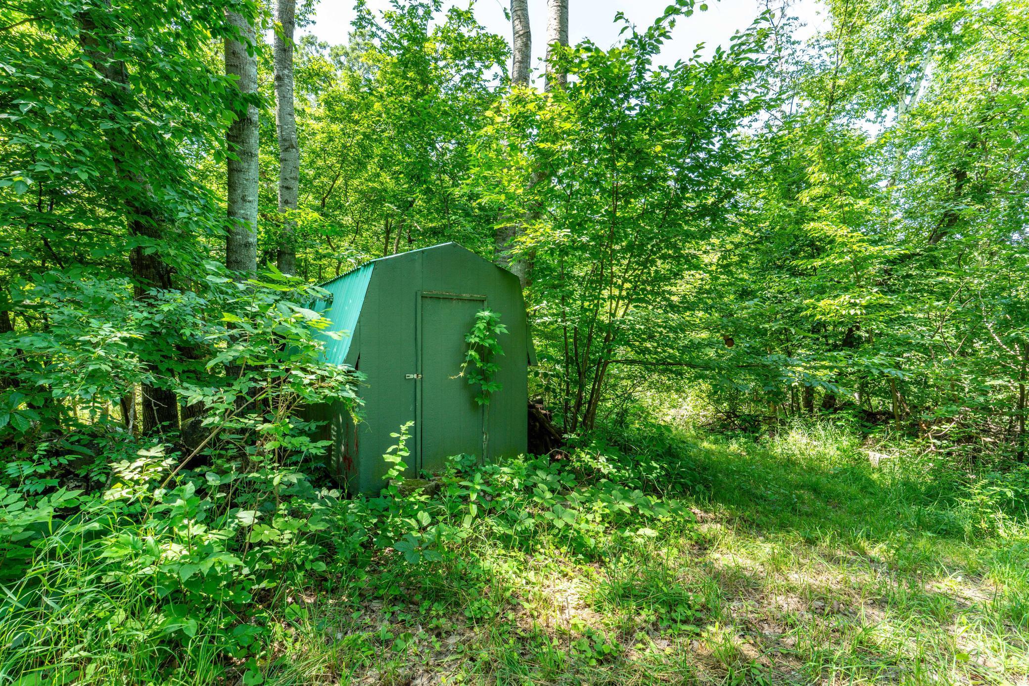 Woodshed on path to lake