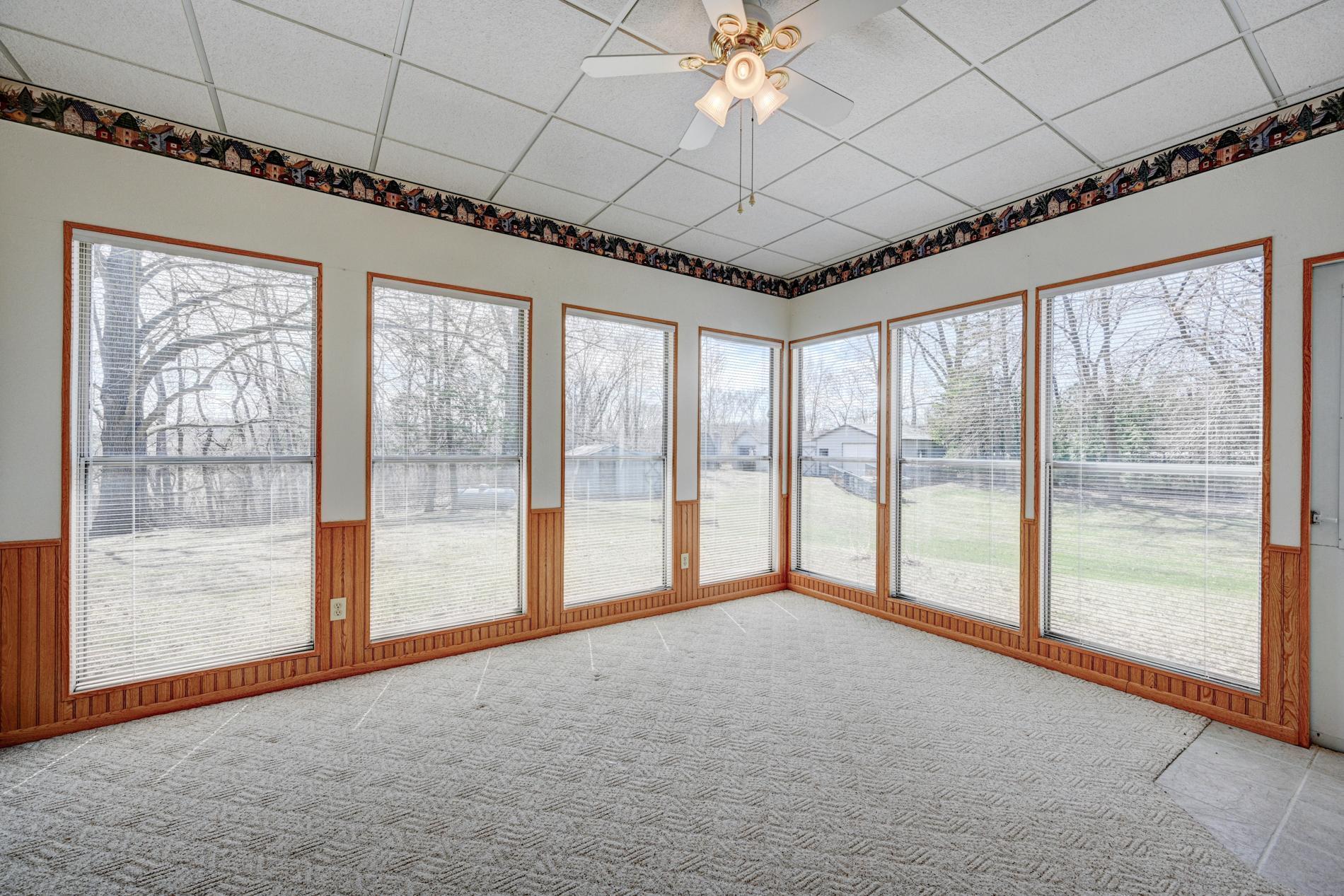 Enjoy your morning coffee or evening views outside the 3 season porch just off the kitchen