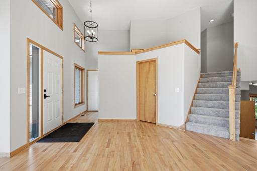 Step inside and be greeted by soaring vaulted ceilings that create a grand entrance.