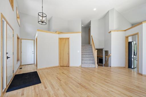Natural light fills the space, highlighting the freshly refinished hardwood floors.