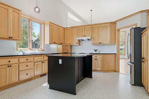 The kitchen island serves as a natural gathering place.
