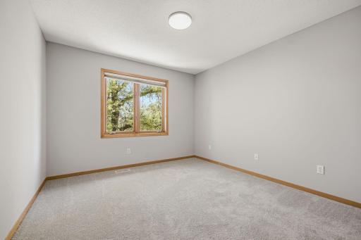 Upper-level bedroom filled with natural light.