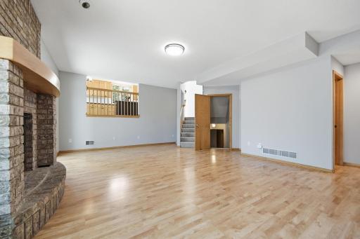 This space connects seamlessly to the kitchen and lower level.