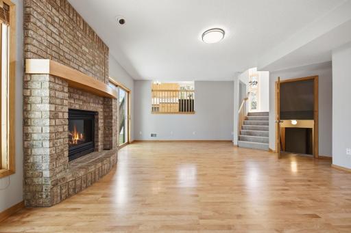 The brick fireplace adds warmth and character to the room.