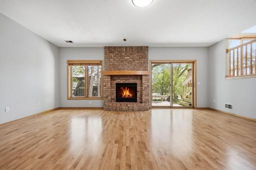 The combination of fireplace and deck access makes this an ideal gathering space.