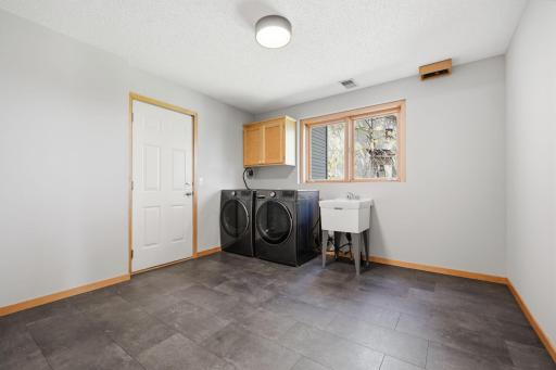 A large mudroom and laundry area with excellent storage and garage access.