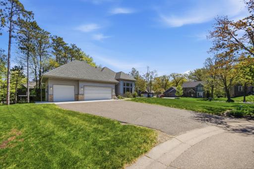 A long driveway tucked into a quiet cul-de-sac offers both privacy and convenience.