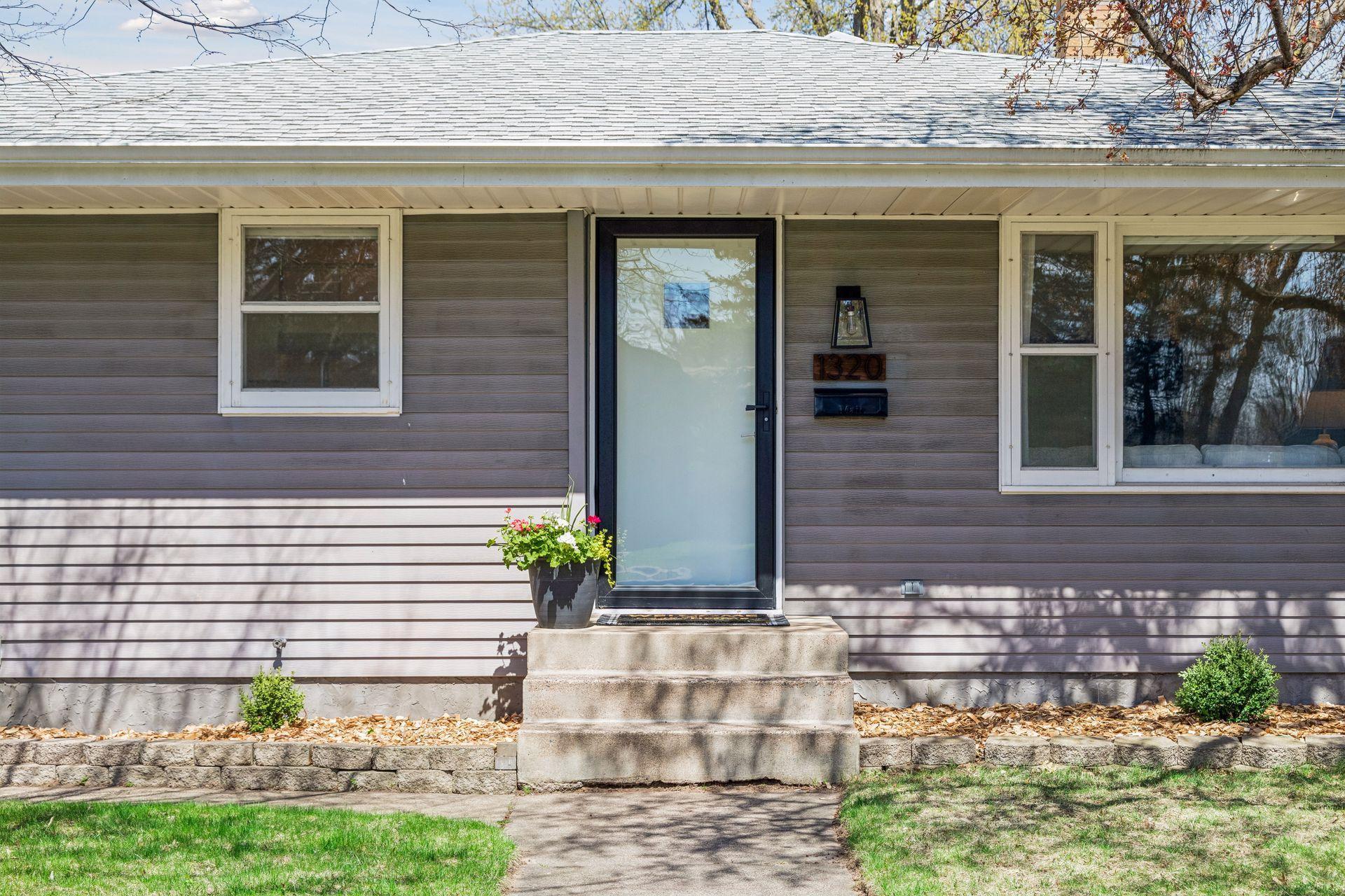 Welcoming front steps leading you into the home’s inviting main entry.