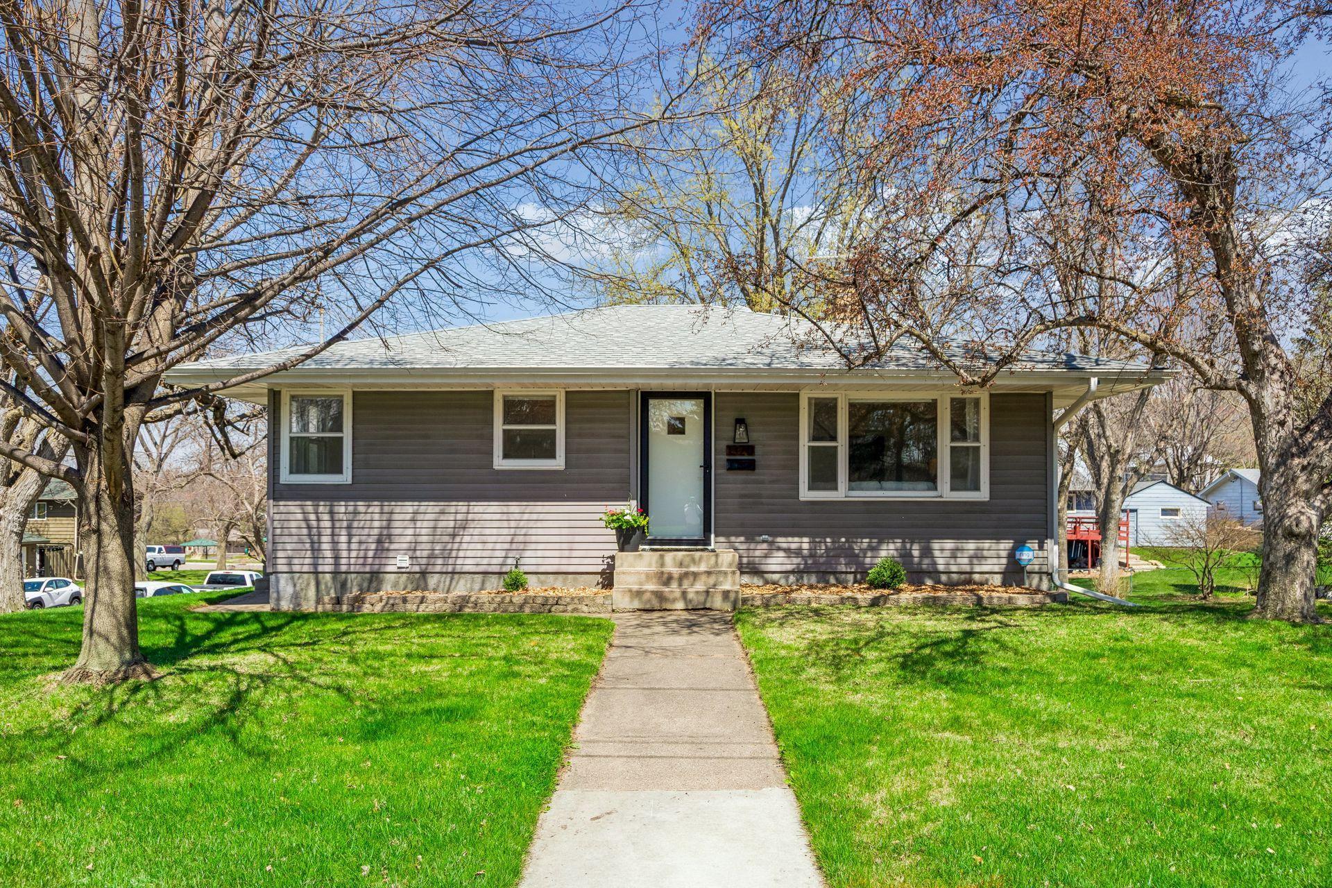 Charming exterior with attractive curb appeal and a welcoming sidewalk leading to the front entry.