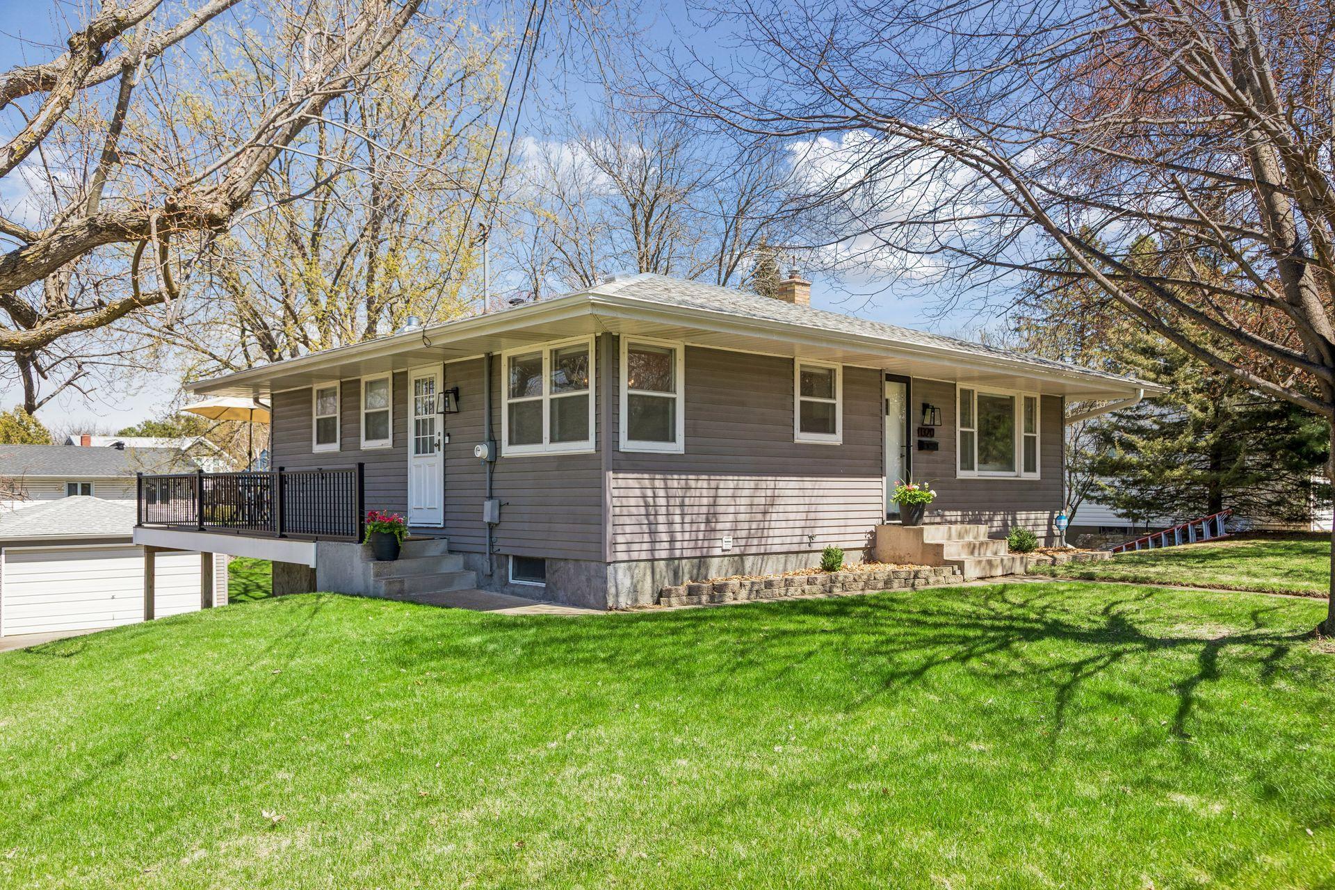 Side view showcasing the newer Trex decking, wrapping from the side entrance to the backyard.