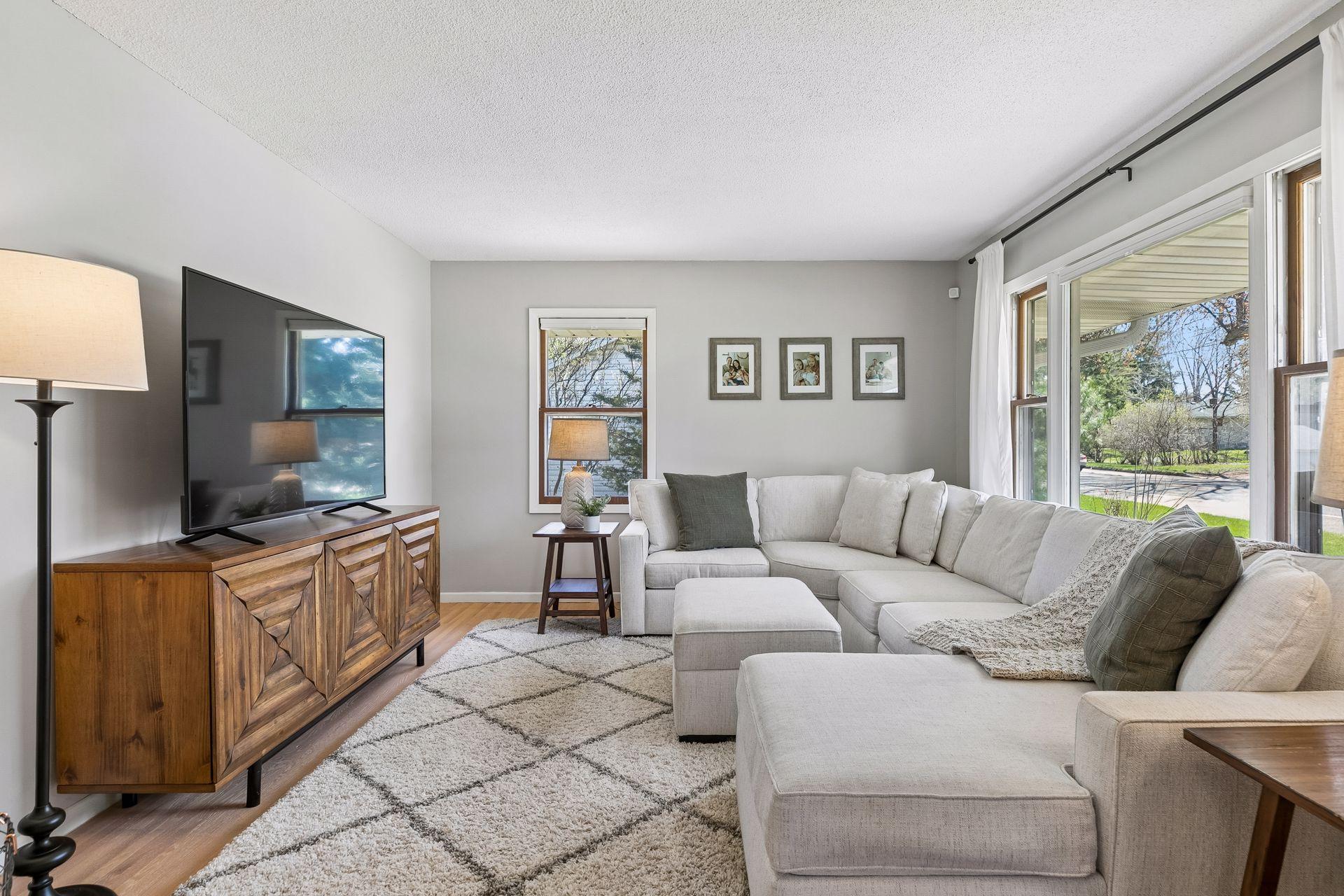 Abundant natural light pours in through multiple windows, brightening the entire space.