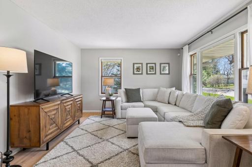 Abundant natural light pours in through multiple windows, brightening the entire space.