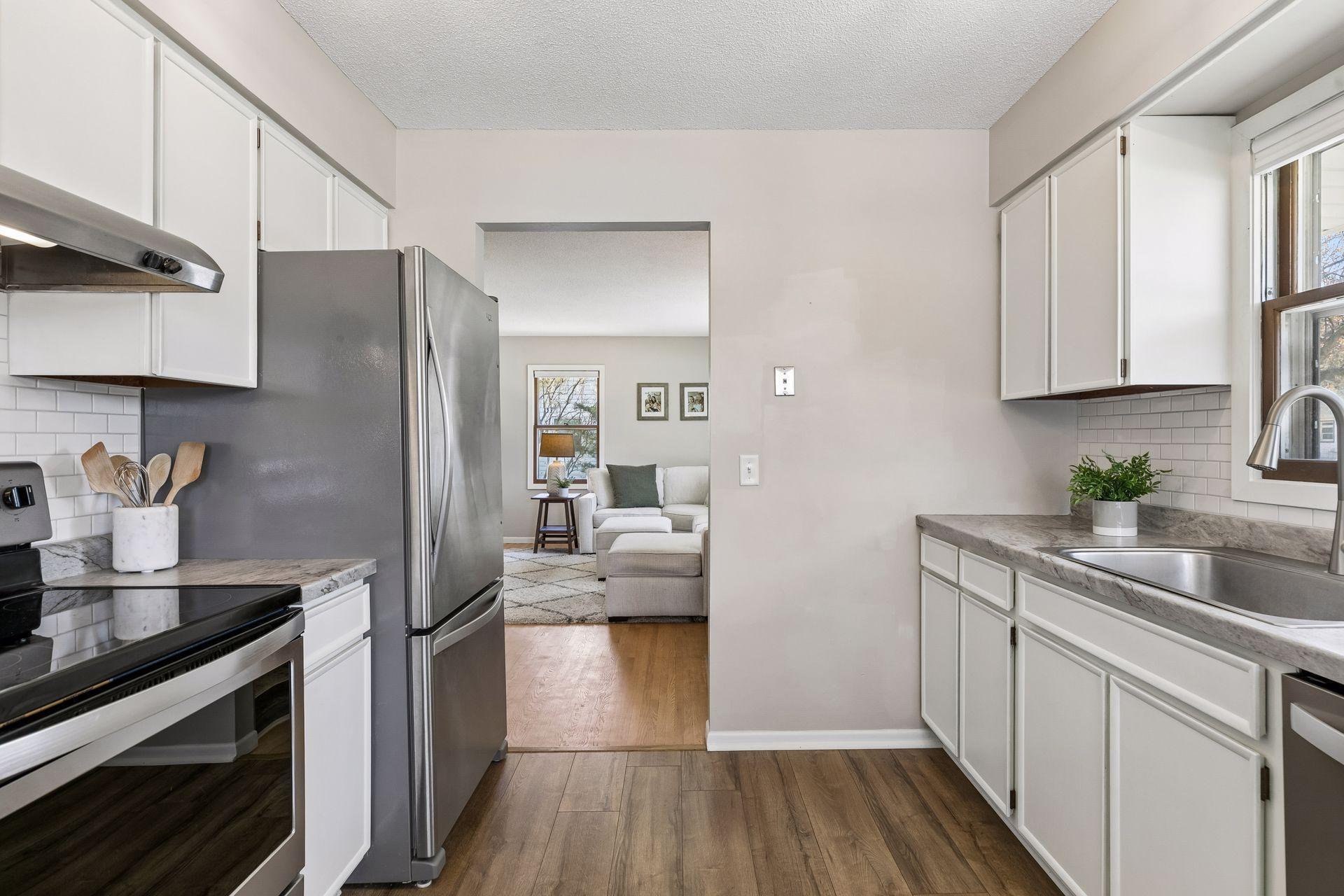 Another view of the kitchen highlighting its functionality and newer appliances.
