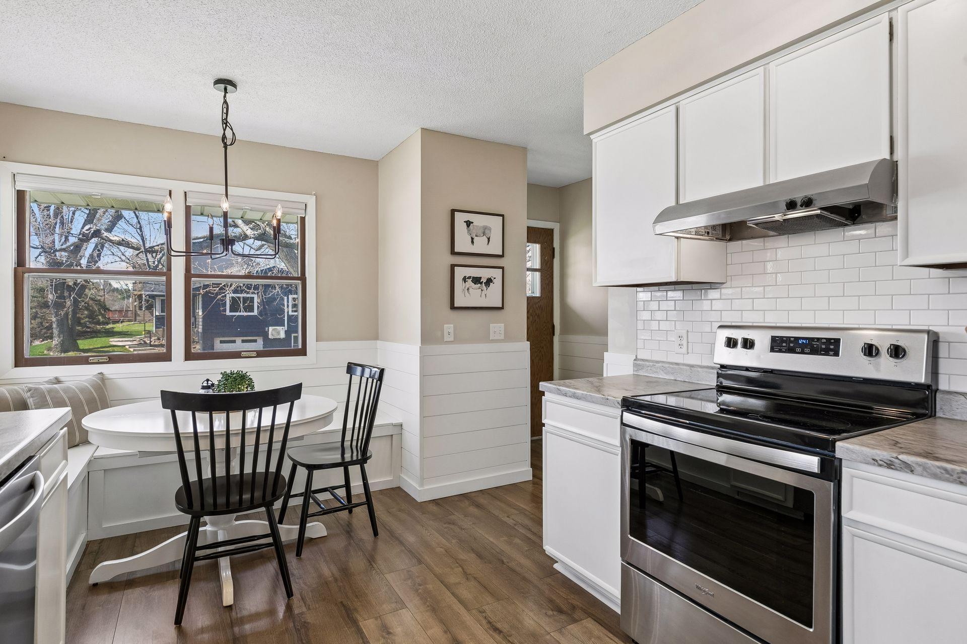 Charming shiplap accents and a spacious eat-in area that comfortably seats many.