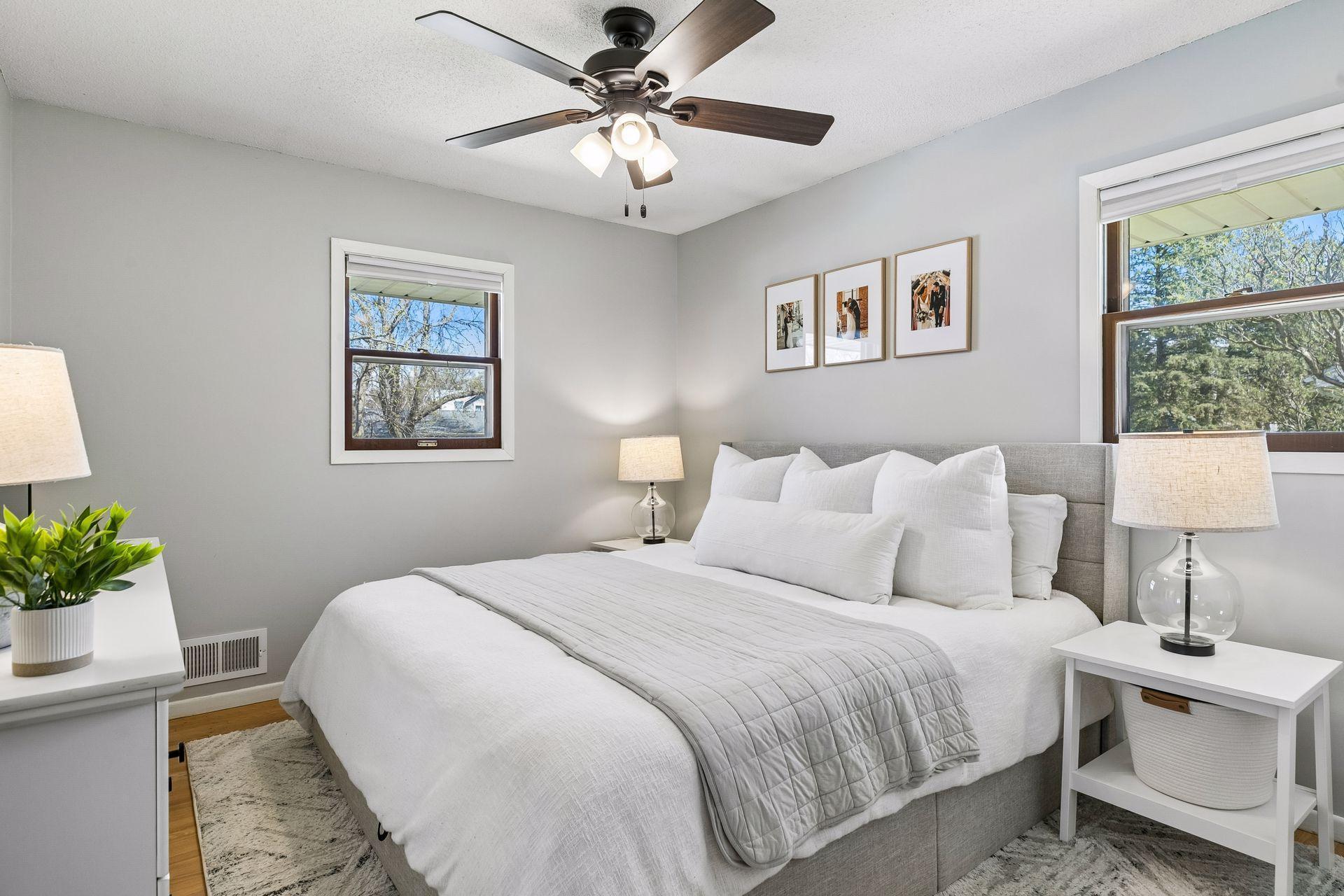 Spacious primary bedroom currently set up with a king-size bed and room for two nightstands.